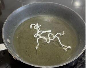 Rice Noodles frying in oil