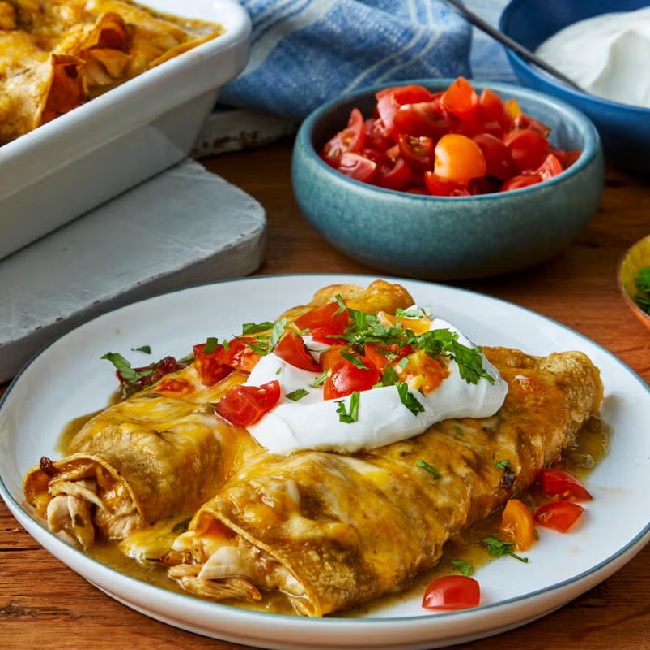 Delicious homemade chicken enchiladas with fresh toppings