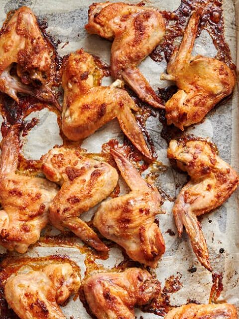 Golden baked chicken wings with assorted dipping sauces